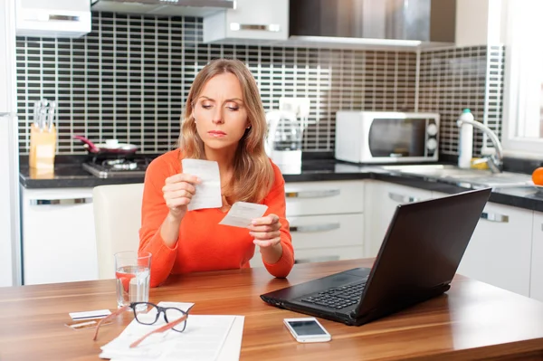 Woman looking at her financial debts