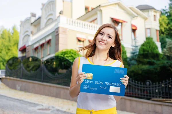 Woman holding banking card