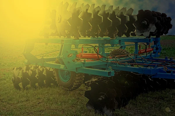 Agricultural equipment in sunset light. Detail 21