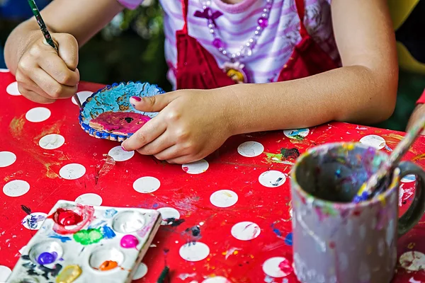 Children painting pottery 13