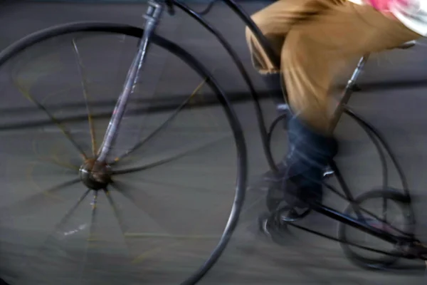 Bike man, with one old bike, on blurred background