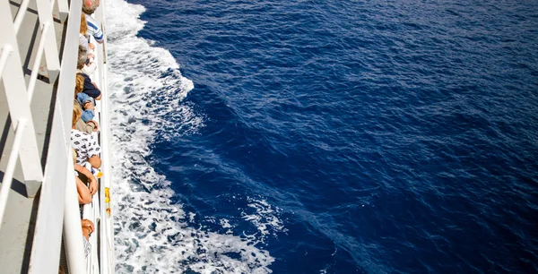 Passengers of cruise ship looking at sea, top view