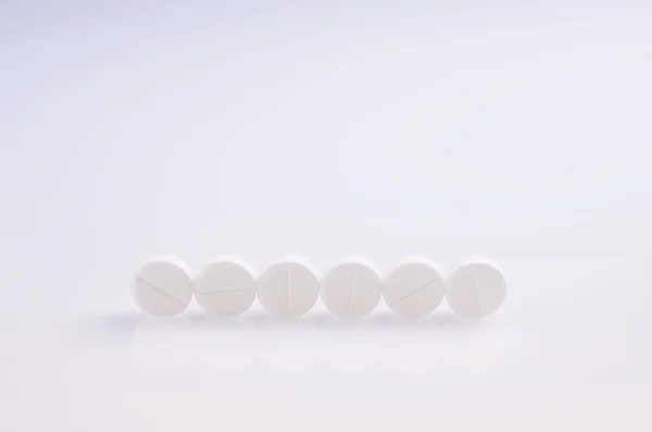 Six white pills