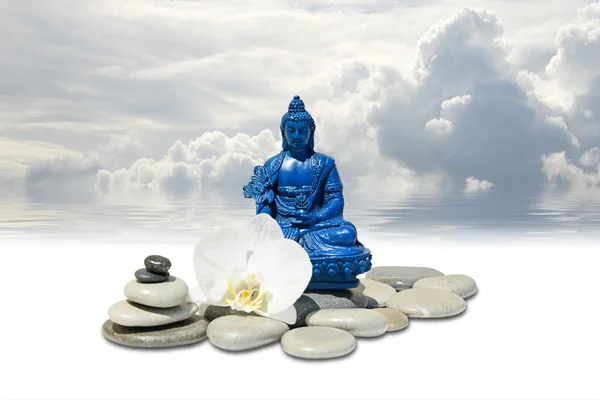 Zen or Feng-Shui background-Blue Medicine Buddha Bhaisajyaguru,zen stone,white orchid flowers and sky reflected in water