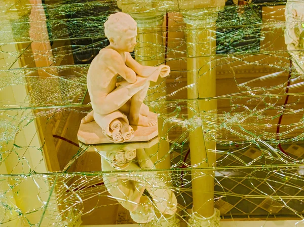 Statues on broken glass in Modern Art National Museum in Rome It