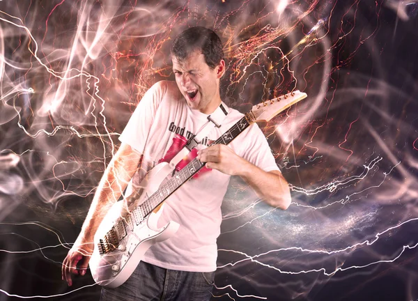 Guitar player with white electric guitar