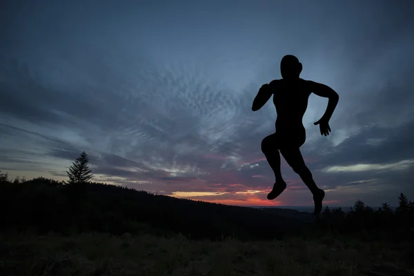 Silhouette of runner during outdoor cross-country running