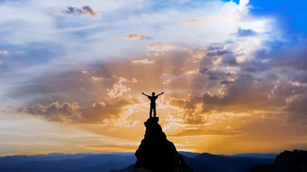 Man on the top of a rock