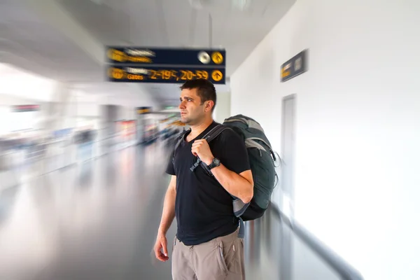 Young tourist man in airport. Travel concept