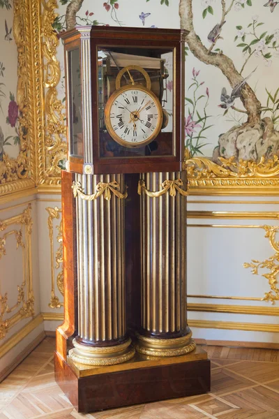 Old grandfather clock in luxury interior