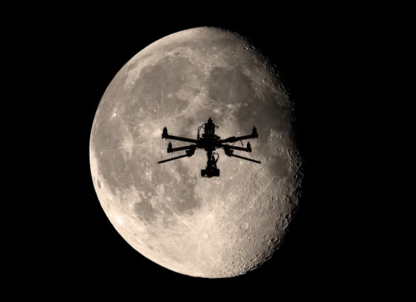 Drone in front of the moon