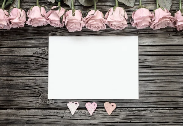 Blank paper with Valentines hearts and roses