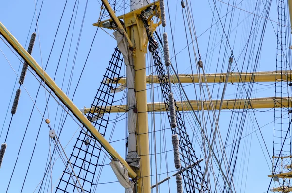 Sailors on the rigging of a tall ship