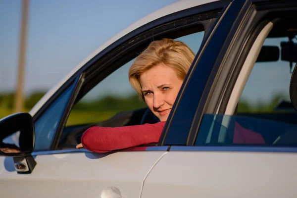Smiling middle-aged female driver