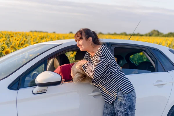 Two women fighting in a car