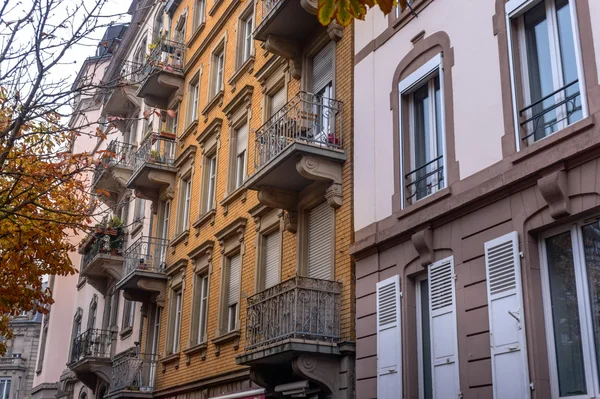 Facade of old European building with balcony autumn