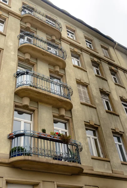 Facade of old European building with balcony autumn