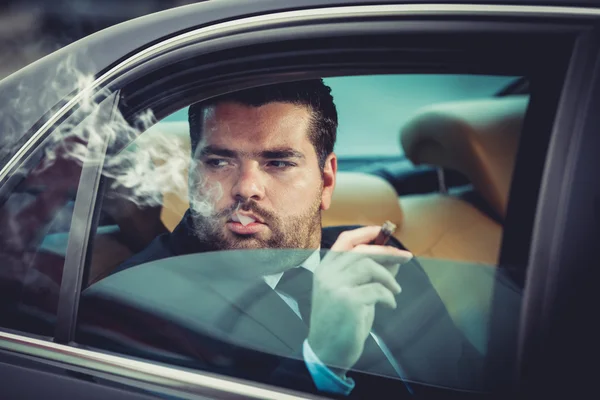 Dangerous man in the car smoking