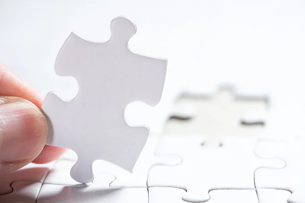 White Blank jigsaw puzzle, business concept of Solution