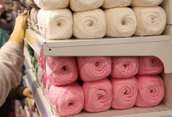 Balls of wool for sale on the shelf