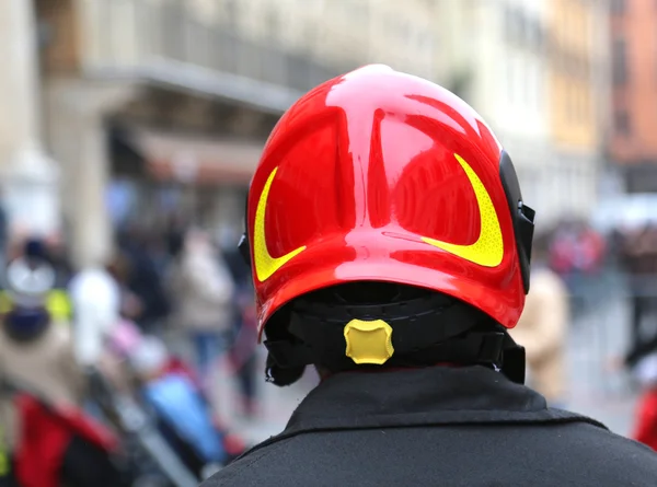 Fireman with red hard hat in the city