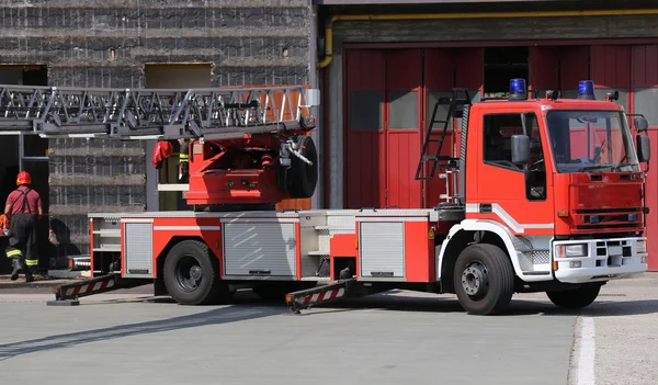 Fire engine truck during a fire drill in the fire brigade statio