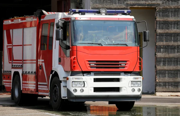 Red fire engine truck during a fire drill