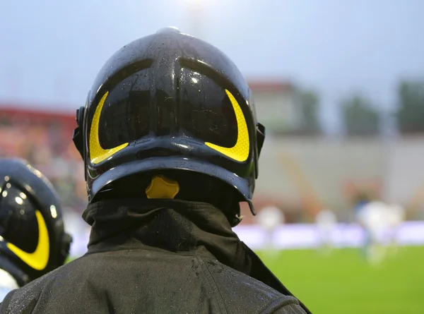 Firefighter with helmet for the security service during the spor