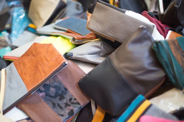 Leather bags of various sizes on sale in the market stall