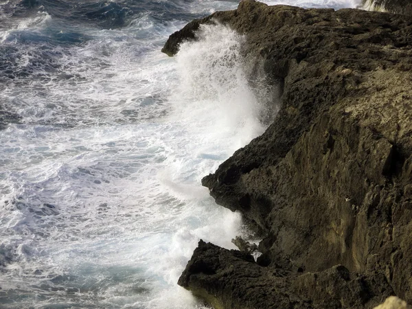 High cliff on the sea with big waves