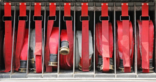 Red pipes in fire trucks to fire off
