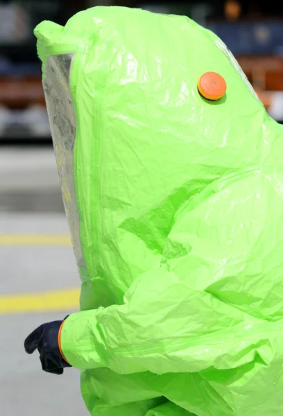 Firefighter with yellow protective gear against biological risk