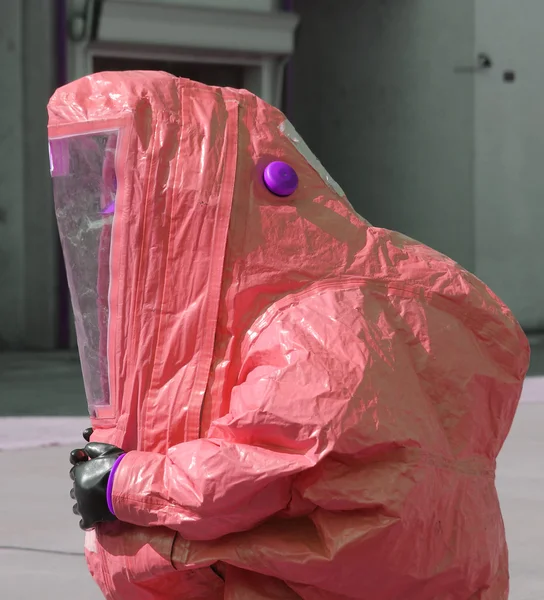 Person with yellow protective suit to work in presence of asbest