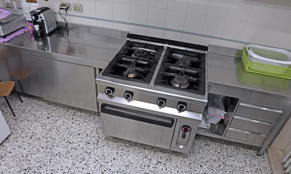 Industrial kitchen with steel stove to cook lunches to many peop