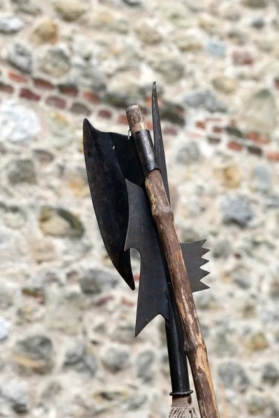 Ancient axe and medieval halberd during combat