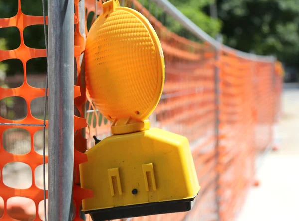 Road yard with signal lamp on road excavation