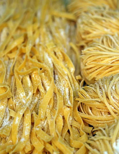 Spaghetti and noodles for sale in Italian pasta shop