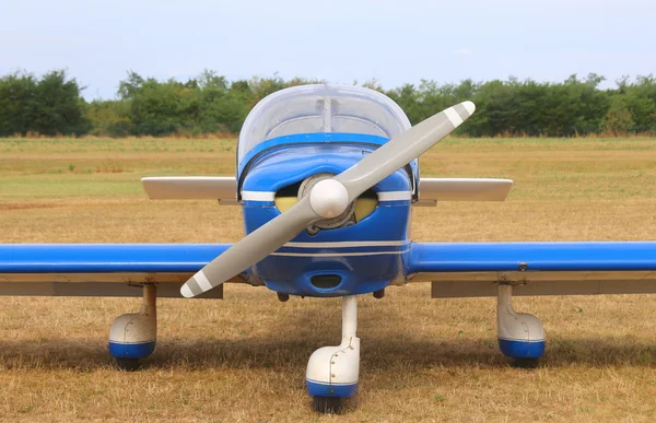 Light aircraft at the airport with a propeller ready for takeoff