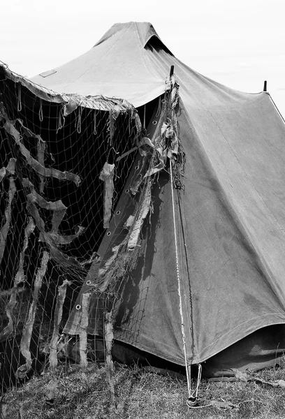 Camouflage military tent in the camp of training
