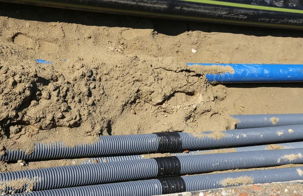 Corrugated pipes for laying electric cables in the excavation