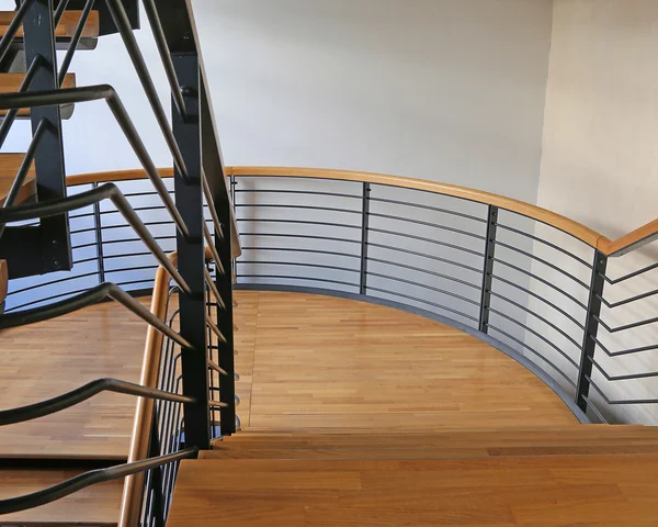 Modern stairs steel and wood in a modern building with parquet