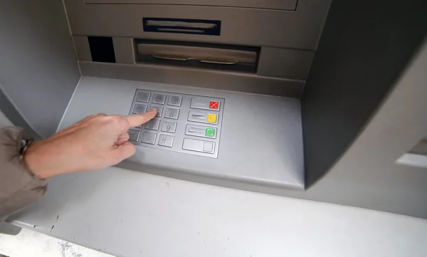 Enter the secret code in the numeric keypad of the ATM