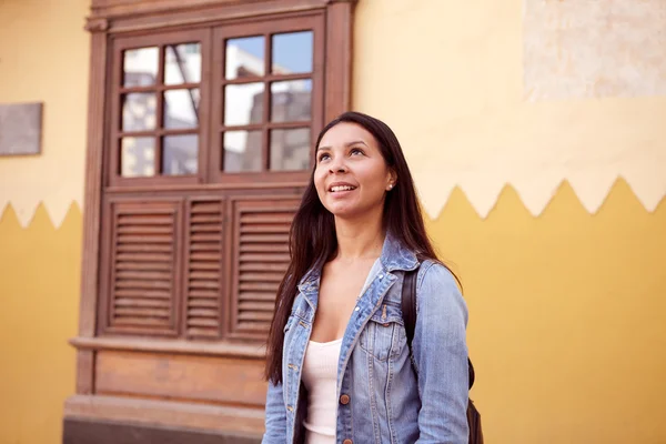 Pretty young girl looking at sky