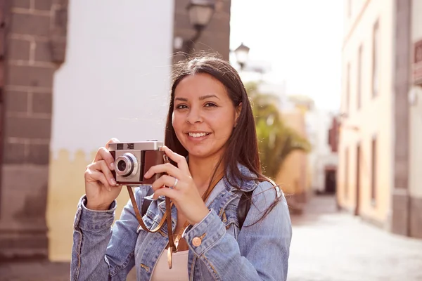 Cute young lady taking a picture