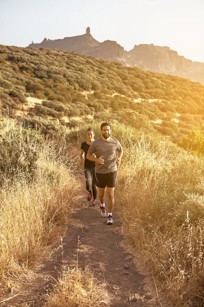 Jogging couple in mountains