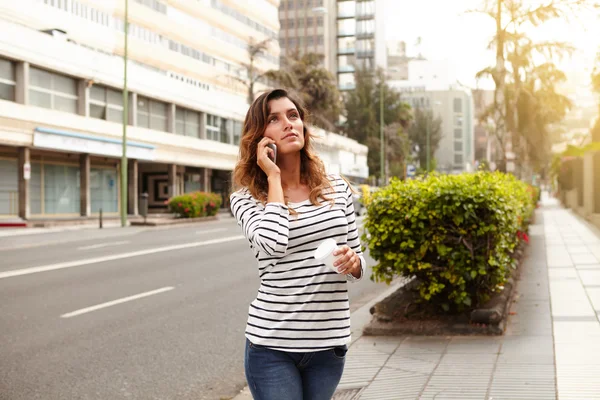 Young lady looking away while walking outdoors