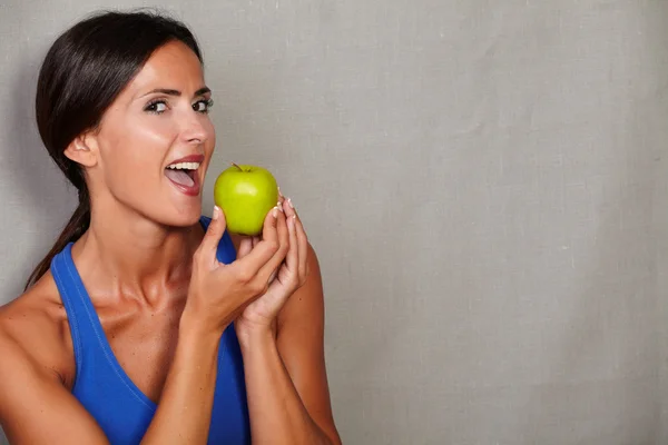 Adult female holding apple
