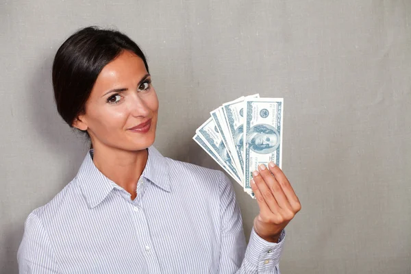 Happy woman showing money