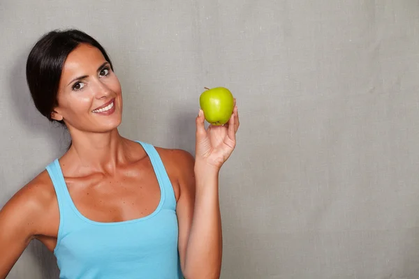 Healthy lady holding apple
