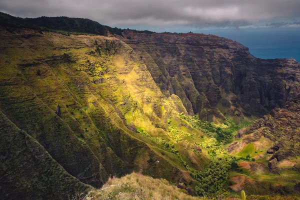 Dramatic landscape view of Na Pali coastline, cliffs and valley